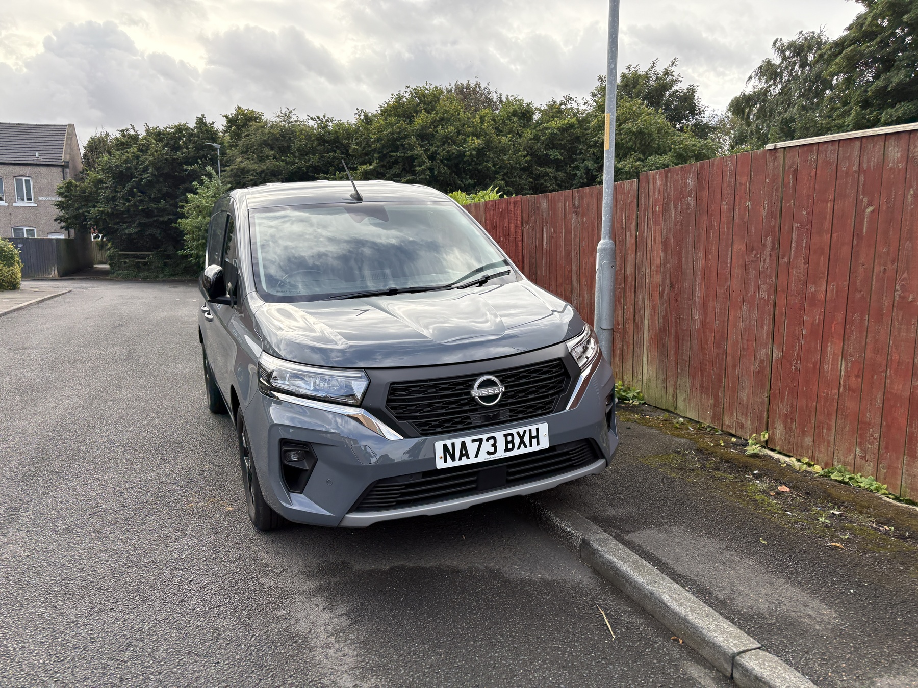 Van 001 — grey Nissan Townstar, front view close up